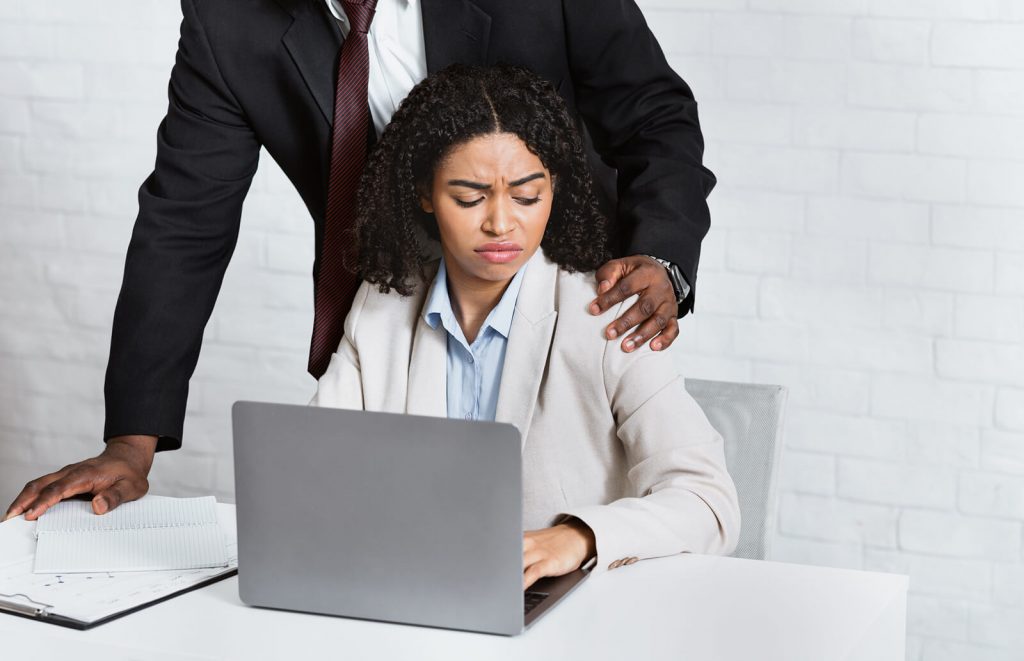 Man in appropriately touching female colleague