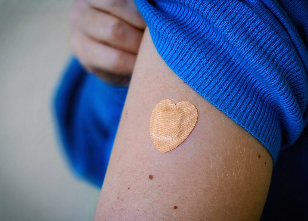 bandaid on arm having received vaccine