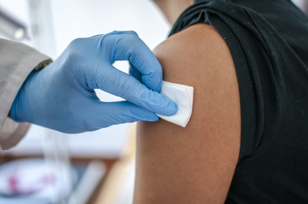 A person about to get a vaccine