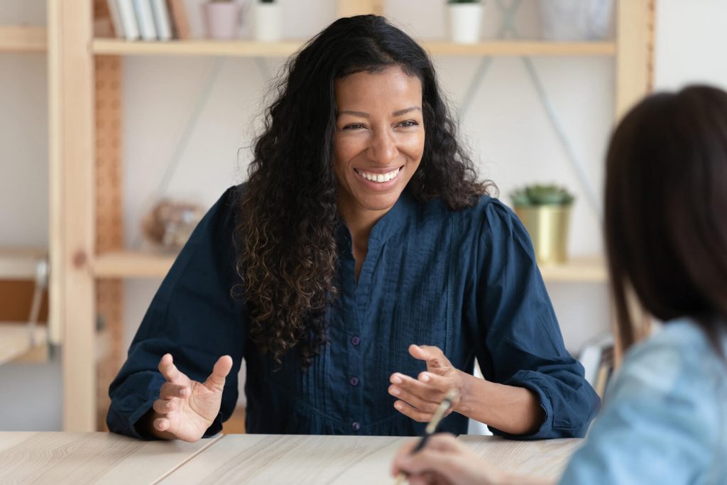 woman smiling while on interview