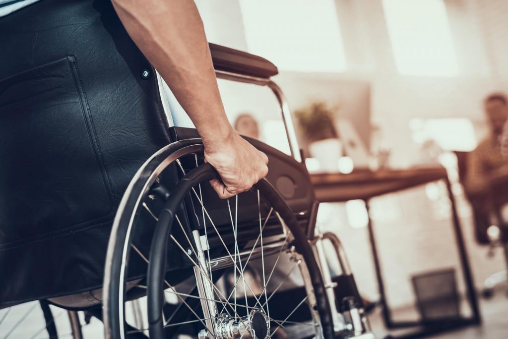 Man in wheelchair at work