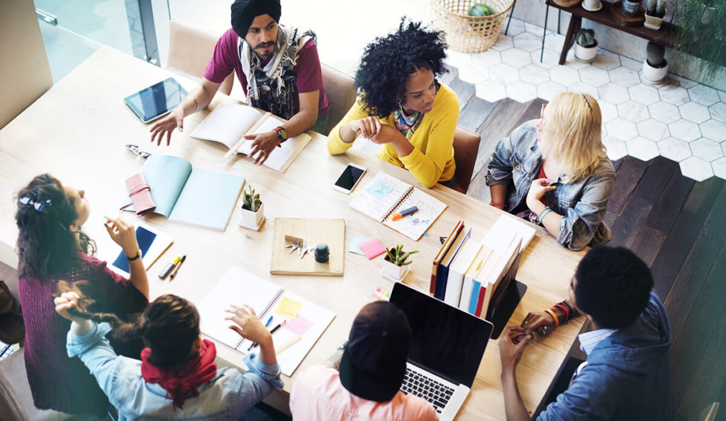 Group sitting around a table at work