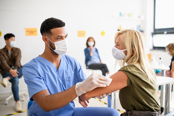 getting vaccine from a nurse