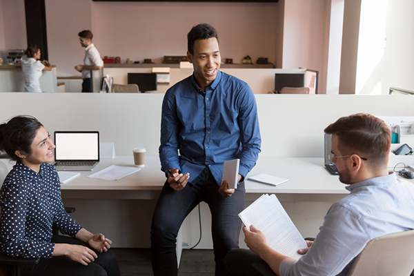 three colleagues talking