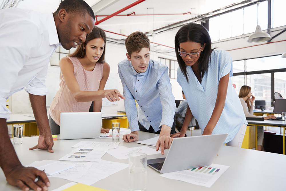 group of workers around table