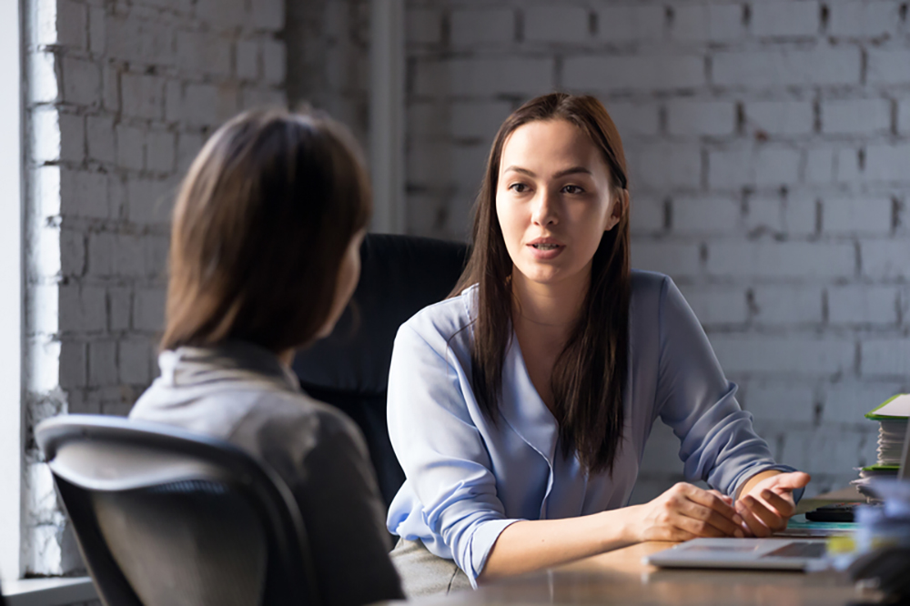 two women having serious conversation