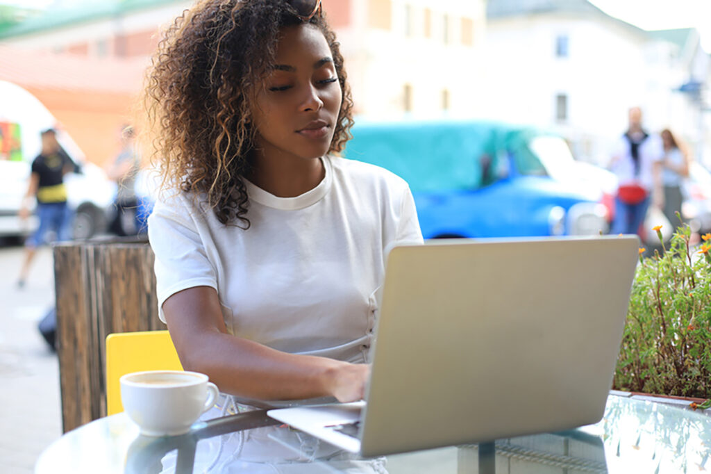 woman working on laptop outside