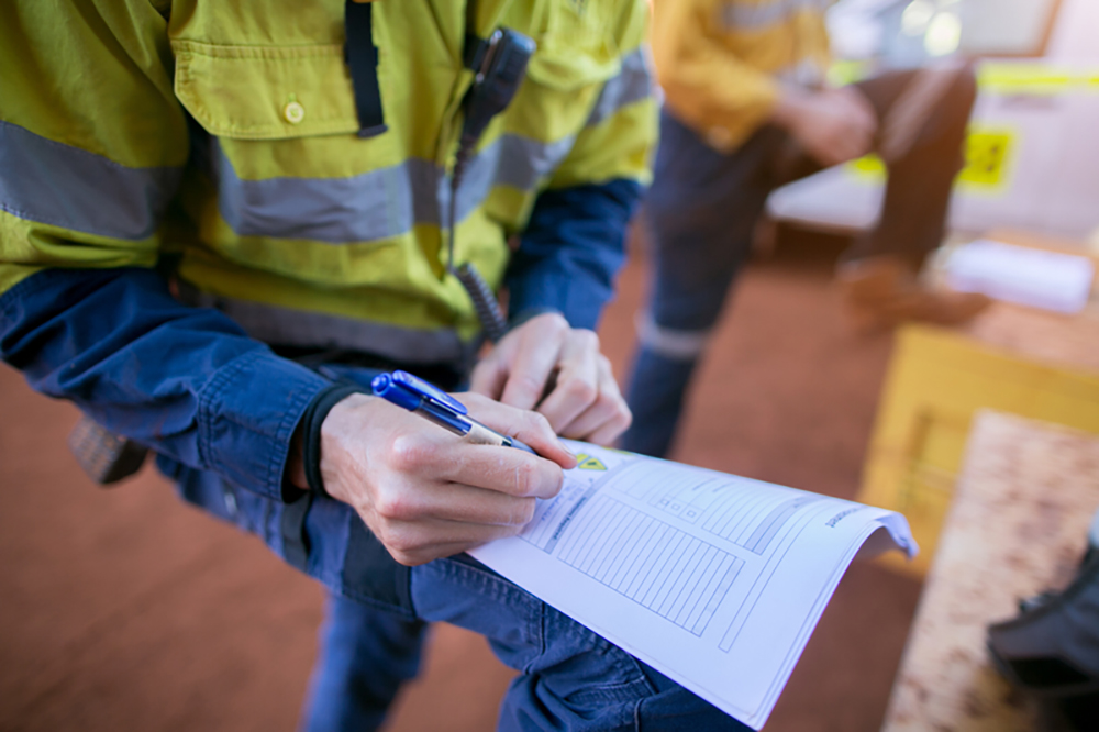 consruction worker with safety log