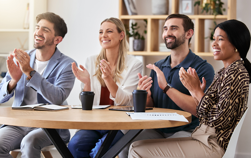 team members clapping