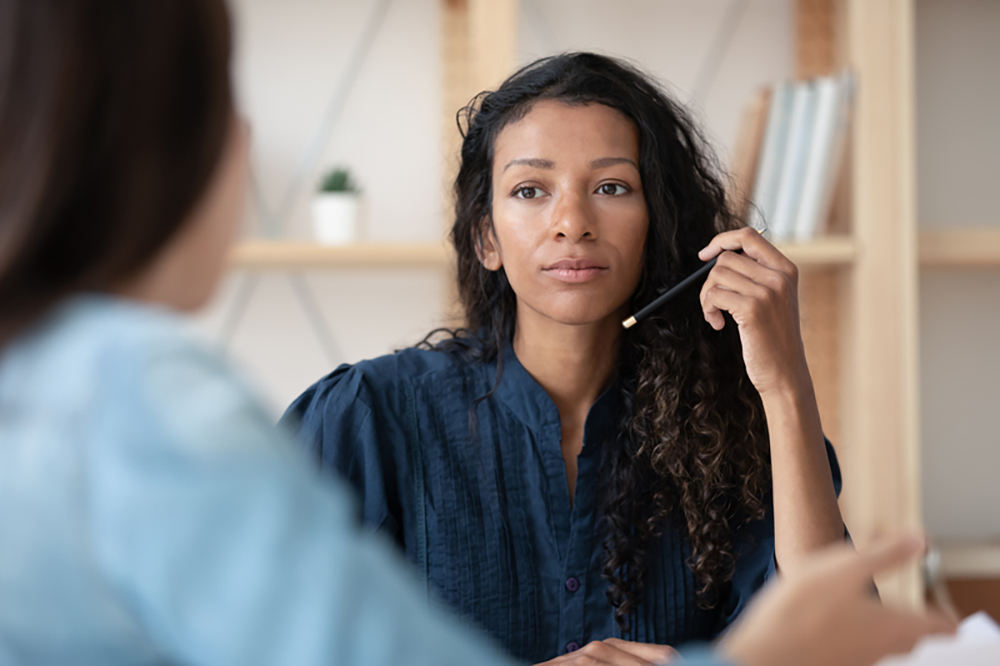 two women in work conversation