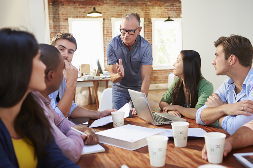 workers talking at table