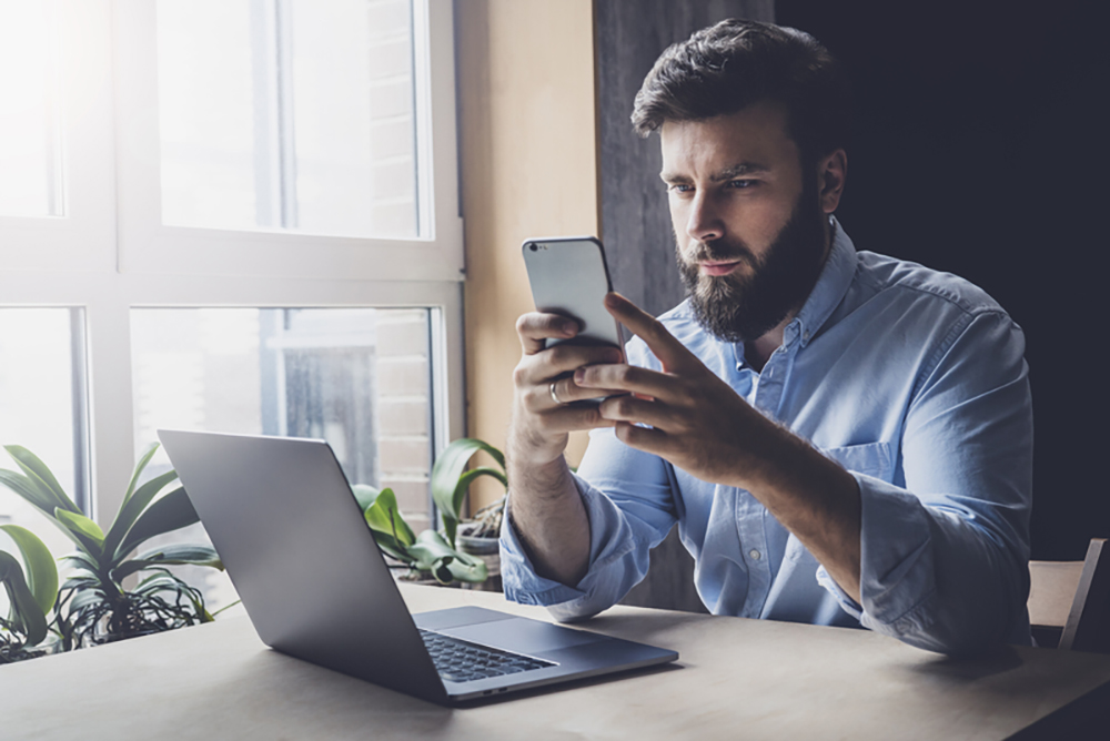 man checking phone