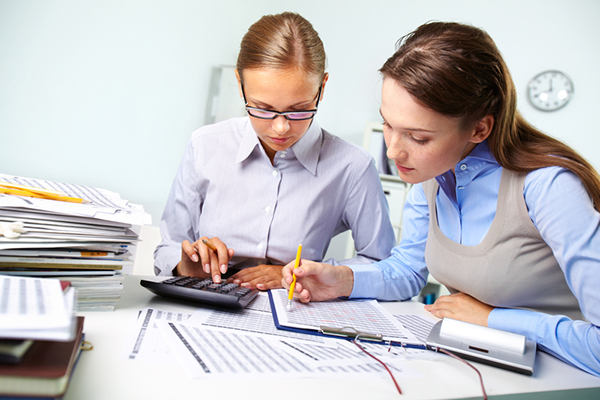 Two women reviewing data at work