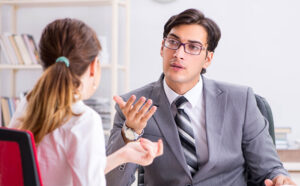 man and a woman talking at work