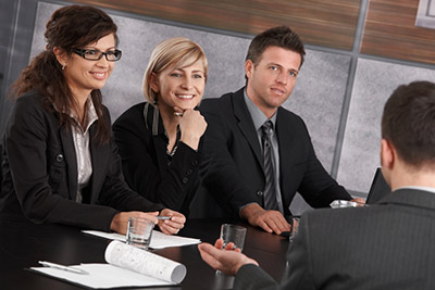 a group of colleagues talking around a table