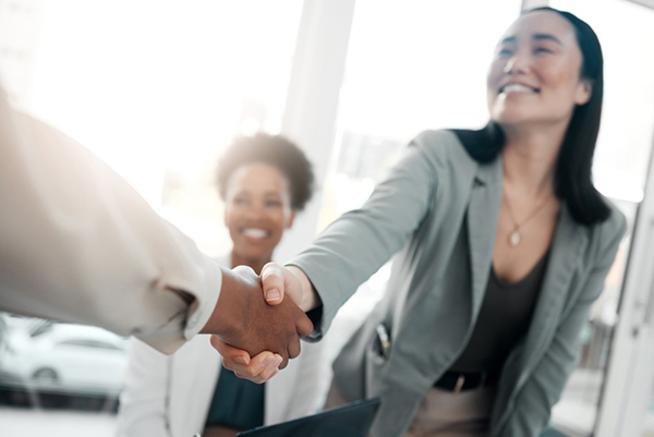 welcoming new employee with a handshake